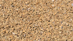 Gold 1/2 inch decorative rock, close-up