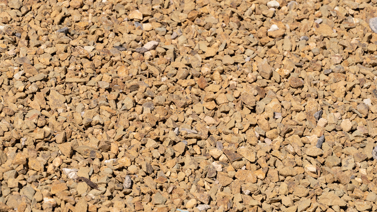 Gold 1/2 inch decorative rock, close-up