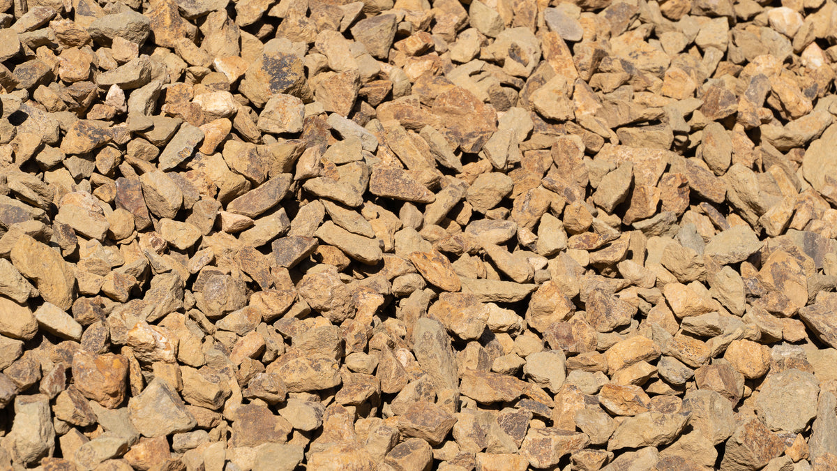 Gold 3/4 inch decorative rock, close-up