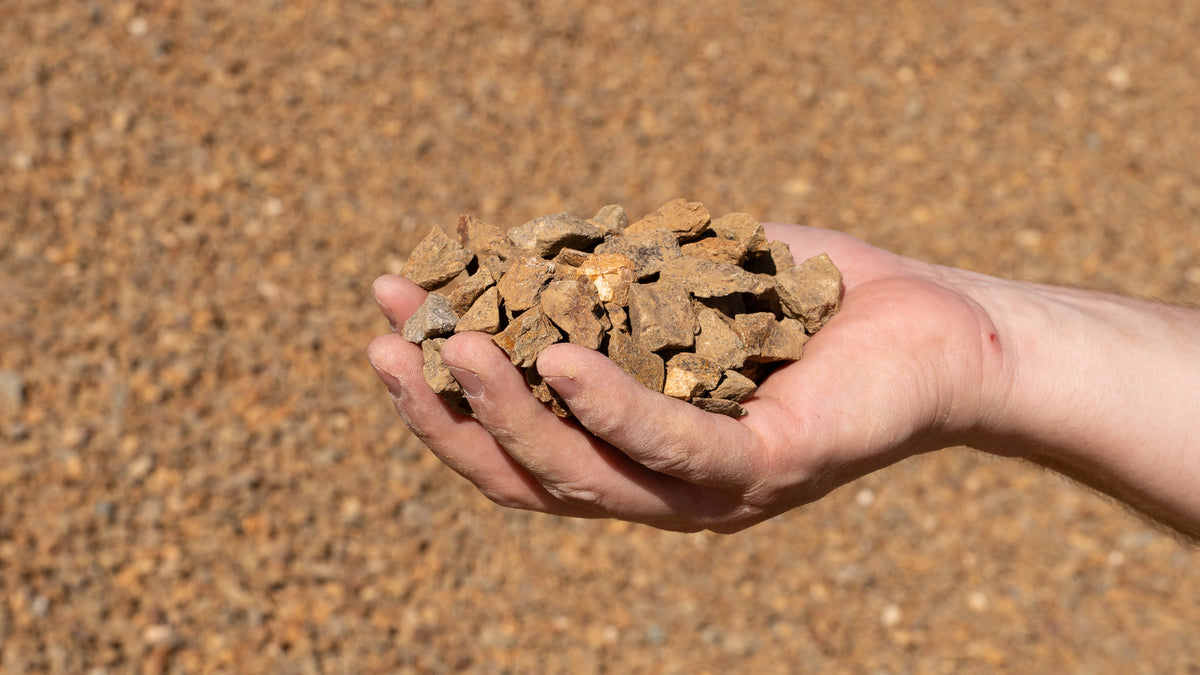Mocha 1/2 inch decorative rock, handful showing size
