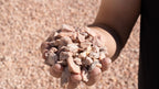 Mountain Rose 3/4 inch decorative rock, handful showing size