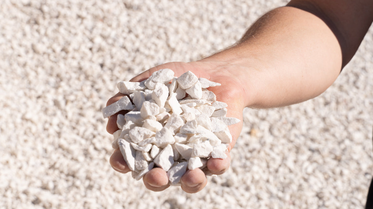 Utah White 3/4 inch decorative rock, handful showing size